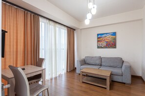 Apartamento Gallery | Zona de estar | Una televisión de pantalla plana