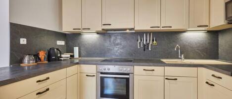 Fridge, microwave, toaster, cookware/dishes/utensils