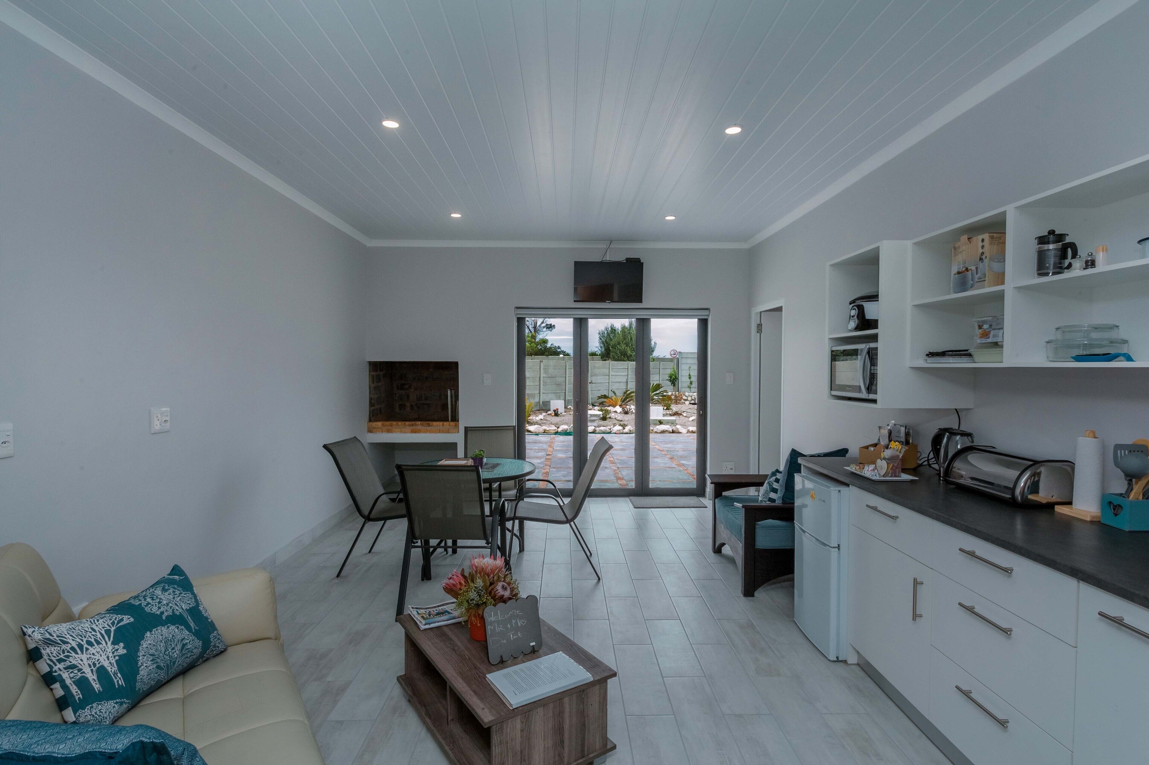 Design Apartment, 1 Bedroom, Courtyard View, Mountainside | Living area | 90-cm Smart TV with digital channels, TV, fireplace