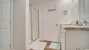 A clean, modern bathroom with a shower, a sink, and a mirror. - Charleston Home w/ Porch - 3 Mi to Folly Beach! (Charleston)