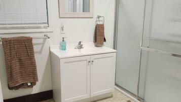 Shower, hair dryer, towels, soap