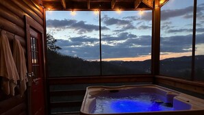A hot tub with a view of the mountains at dusk. - 🌟Private🌟Views🌟x2KingSuites🌟HotTub🌟FirePit🌟NationalPark🌟SunSet🌟 (Sevierville)