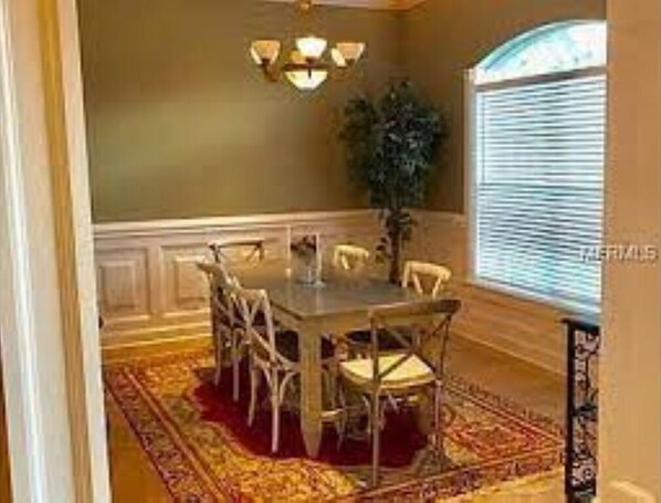 Enjoy meals in this traditional dining area with a large table and six chairs.