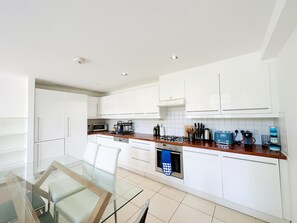 Enjoy cooking in this well-equipped kitchen with an oven, microwave, and coffee maker.