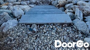 A stone staircase leading to a beach with a clear sky. - Lakefront Cabin Hot Tub Playground Fire Pit (Algoma)