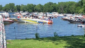 A marina with multiple boats docked. - Lakefront Cabin Hot Tub Playground Fire Pit (Algoma)
