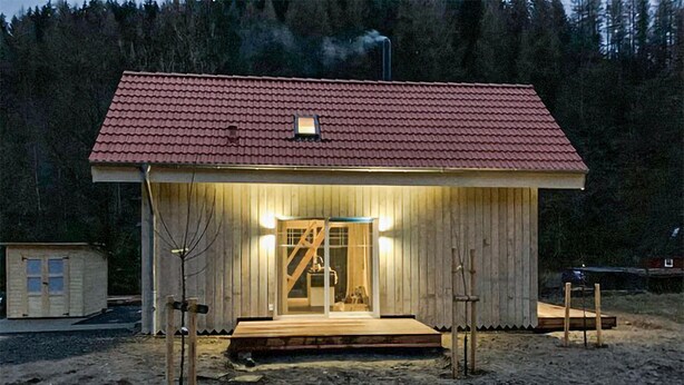 A wooden cabin with a red roof, a wooden porch, and a small window. - Awesome home in Clausthal-Zellerfeld with WiFi (Clausthal-Zellerfeld)