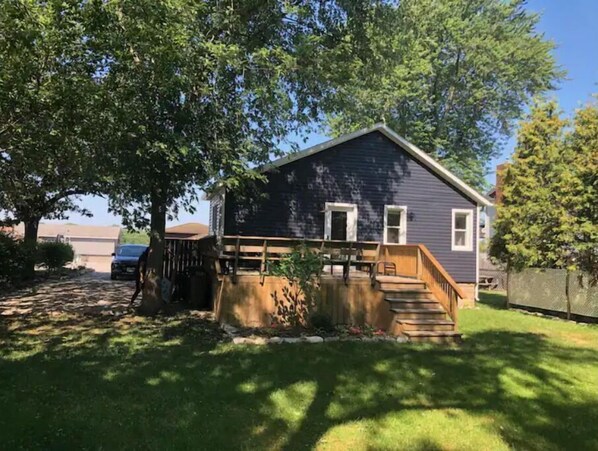 Stroll up the porch to this charming home, featuring a garden and an entrance.