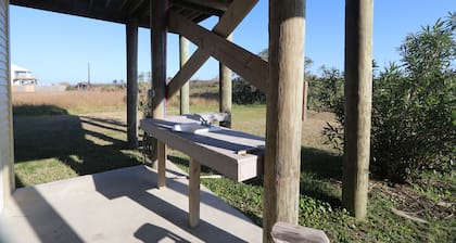 Experience beachfront bliss at Beach Life-Ruff E Nuff in Grand Isle, LA, perfect for families.