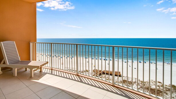 A balcony with a view of a beach and ocean. - Phoenix Gulf Towers 802 | Beachfront | Spectacular Gulf Views | Pools | My Beach Getaways (Orange Beach)