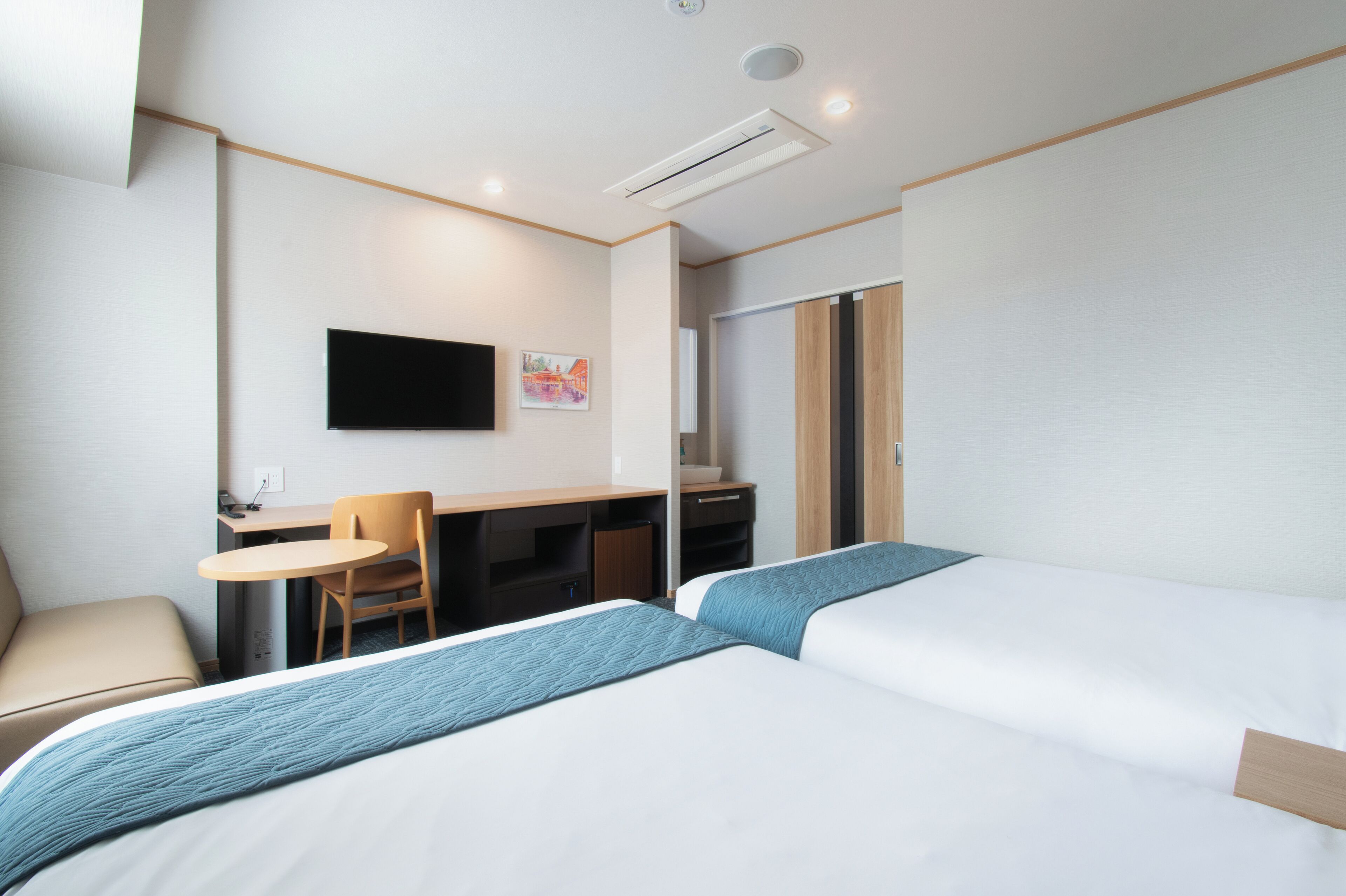 Down duvets, desk, laptop workspace, iron/ironing board