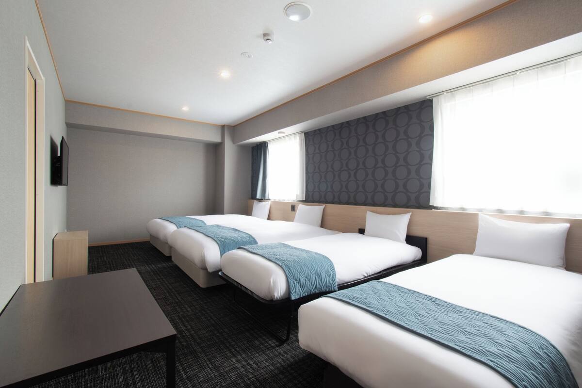 Deluxe Room, Multiple Beds, Non Smoking | Down comforters, in-room safe, desk, laptop workspace