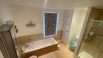 Bathtub, hair dryer, towels
