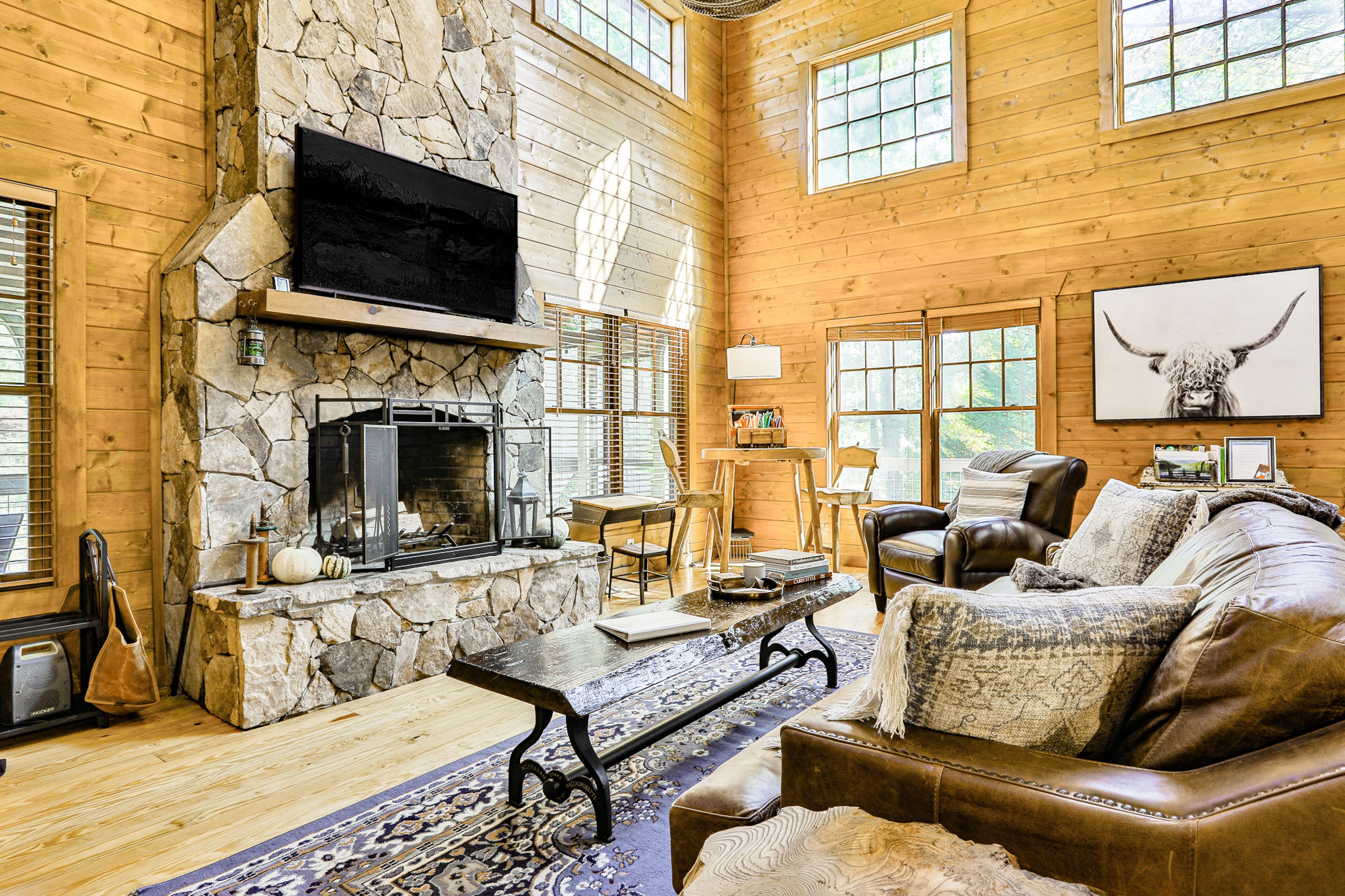 Riverfront cabin with private hot tub, firepit, grill, fireplace, & river views
