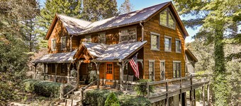 Homey riverfront cabin with hot tub, grill, wood fireplace, AC, & scenic views