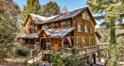 Homey riverfront cabin with hot tub, grill, wood fireplace, AC, & scenic views