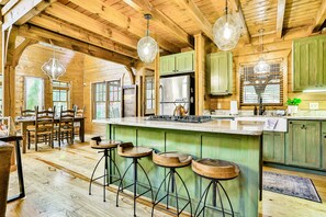 Fridge, microwave, oven, stovetop - Homey riverfront cabin with hot tub, grill, wood fireplace, AC, & scenic views (Young Harris)