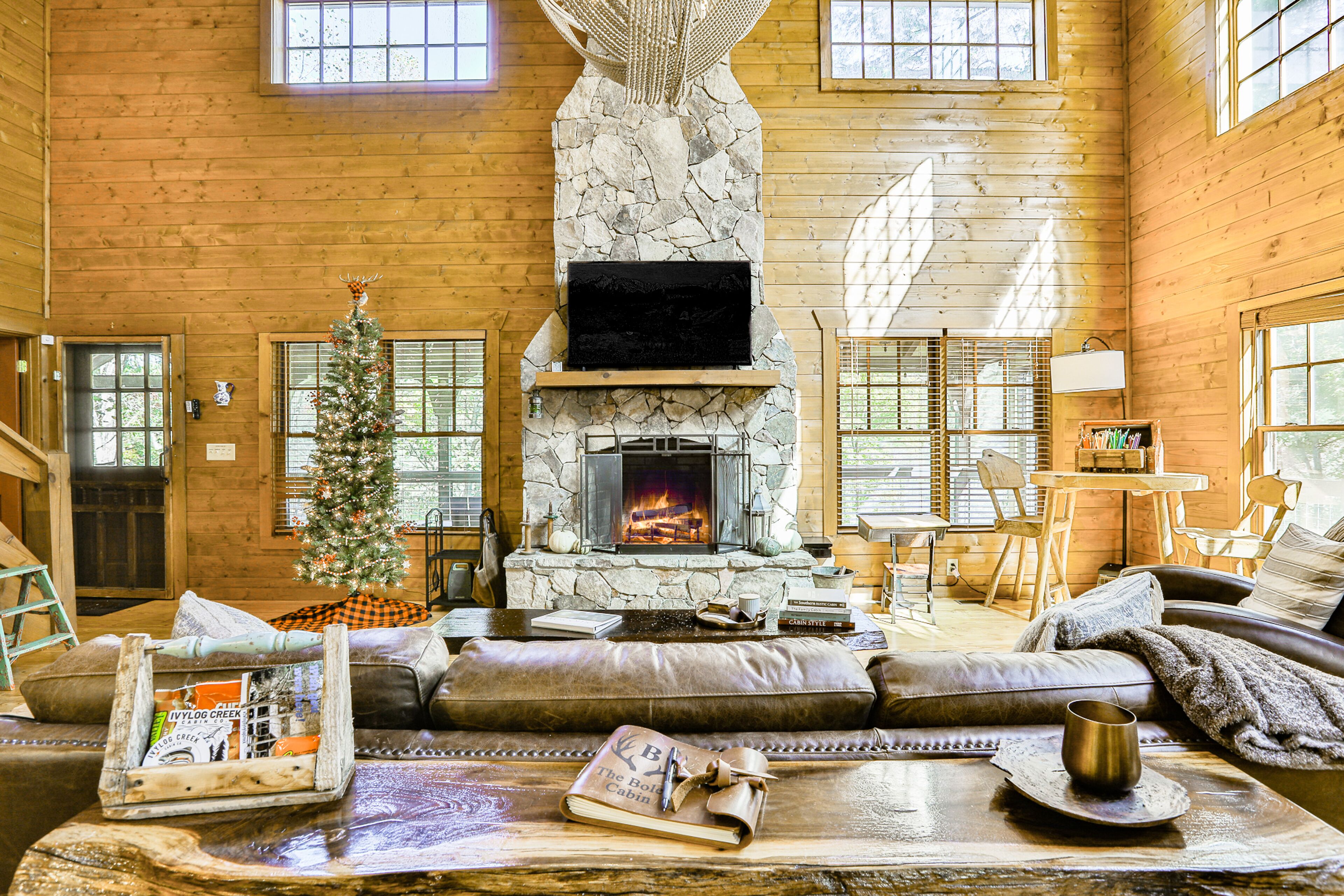 Riverfront cabin with private hot tub, firepit, grill, fireplace, & river views