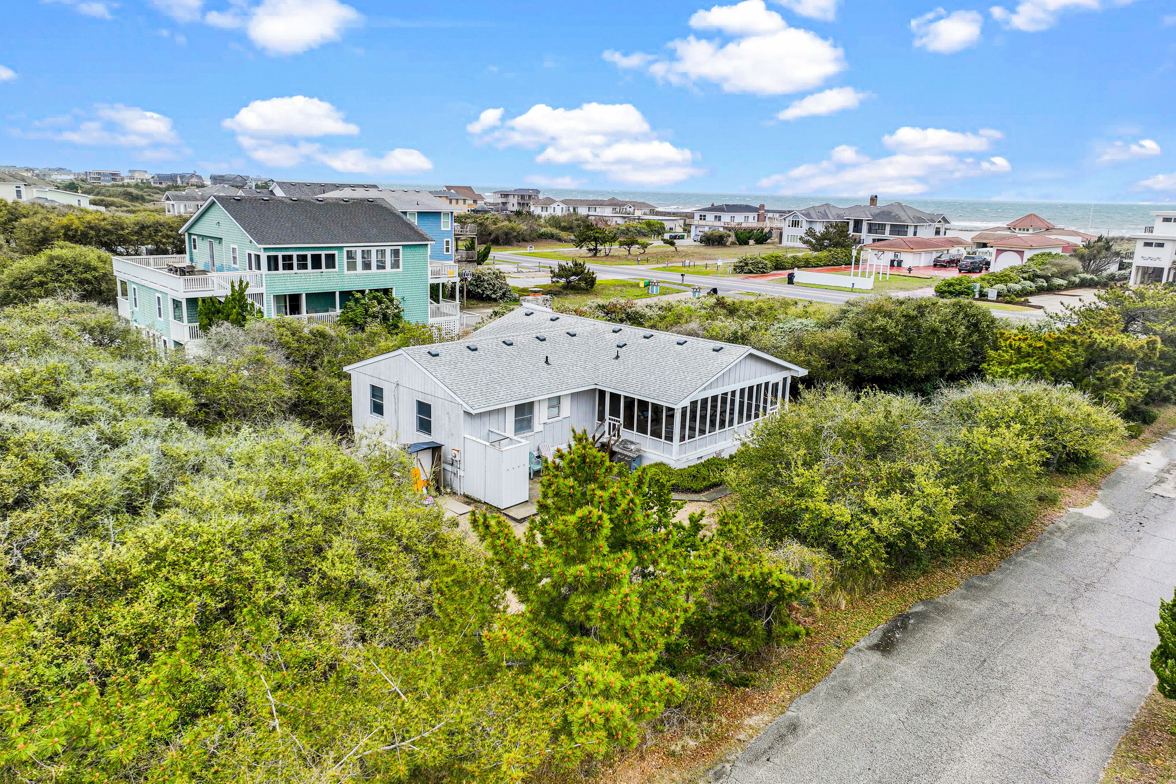 Dog-friendly home near beach with screened porch, fireplace, & outdoor shower