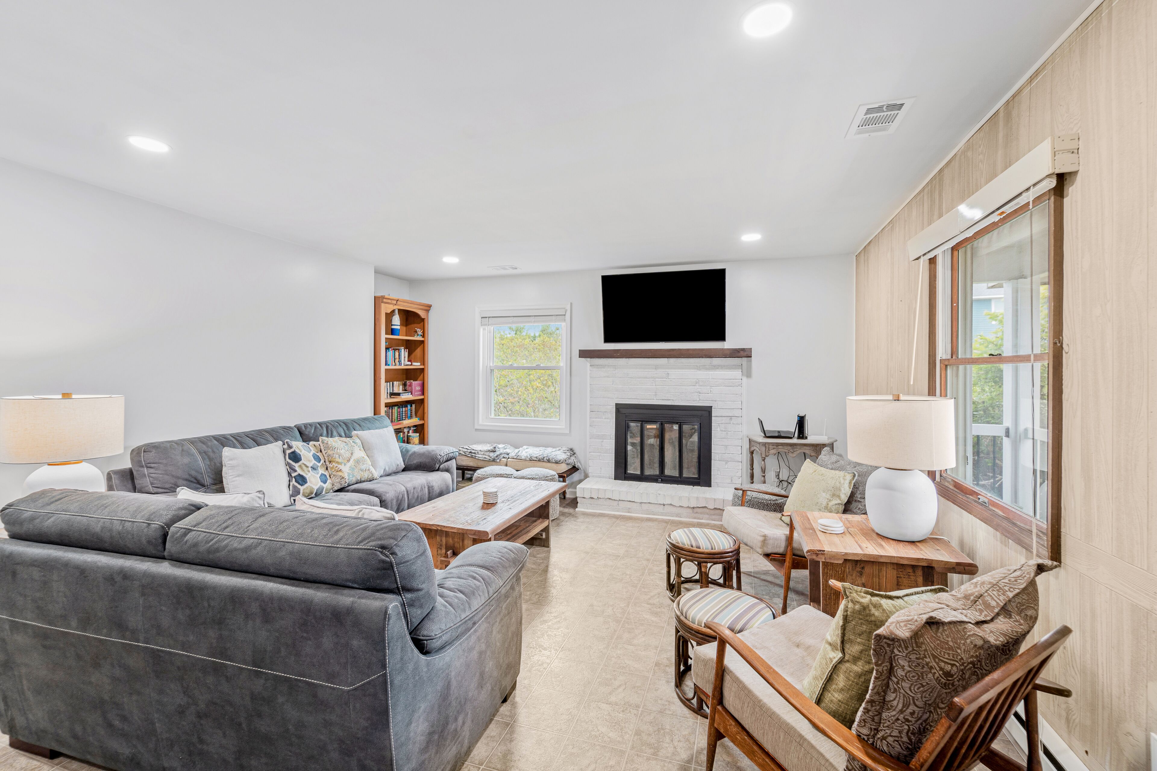 Dog-friendly home near beach with screened porch, fireplace, & outdoor shower