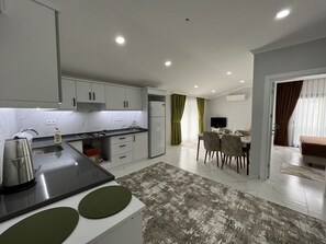 Luxury Room | Private kitchen | Full-size fridge, dishwasher, cookware/dishes/utensils, freezer