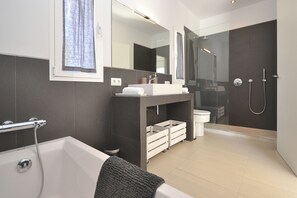 Bathtub, hair dryer, towels