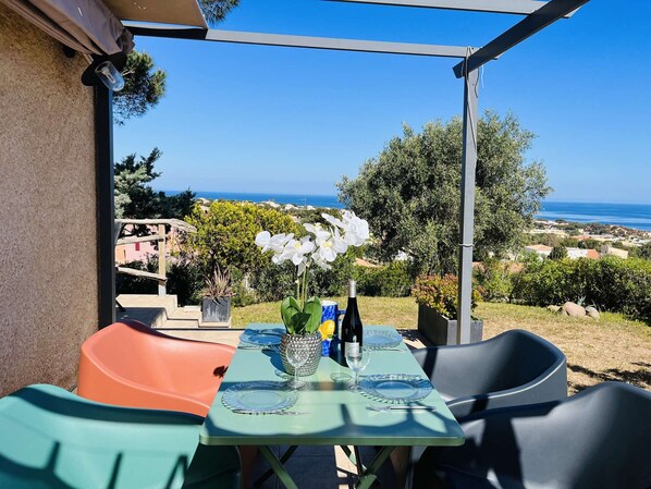 Enjoy a romantic dinner for two on this oceanfront patio with a scenic view.