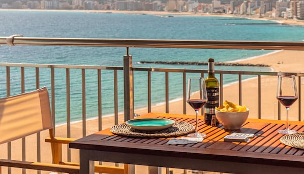 Enjoy a romantic seaside dining experience with a clear view of the ocean and city skyline.