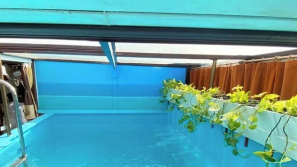 A pool area with a blue interior, metal railings, and potted plants along the side. - Vacation Home 'Las Vistas' with Mountain View, Private Terrace and Wi-Fi (Valleseco)