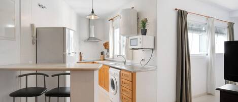 Fridge, microwave, stovetop, coffee/tea maker