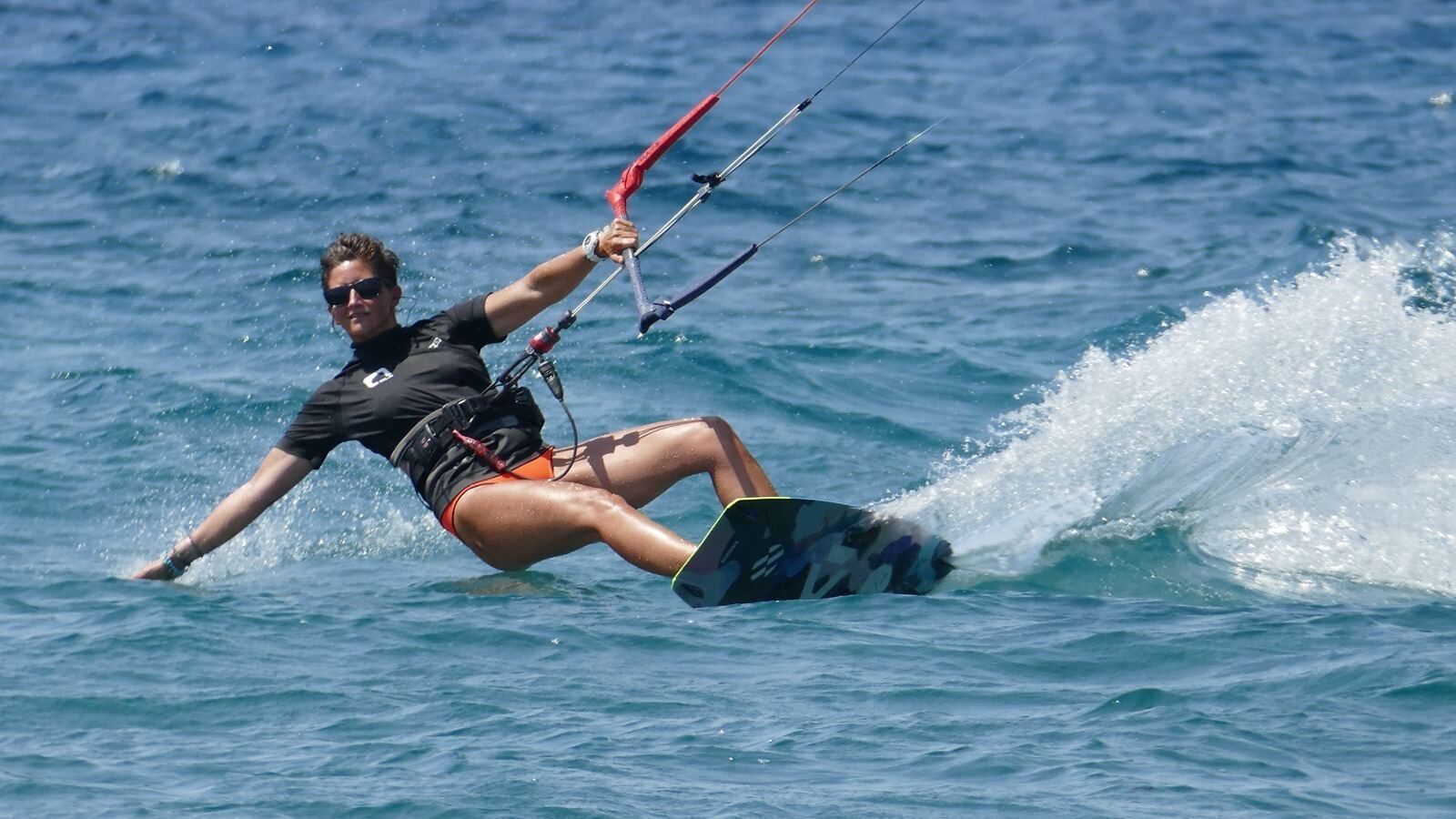 A person windsurfing on a clear day.