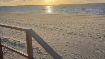 On the beach, sun loungers