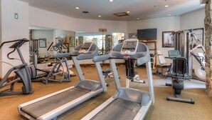 A gym with treadmills, elliptical machines, and weight equipment. - Summit View- Big Sky Shoshone Ski in/Out, Heated Pool (Big Sky)