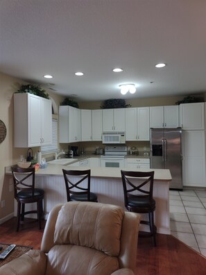 Enjoy casual dining at the central island with bar stools.