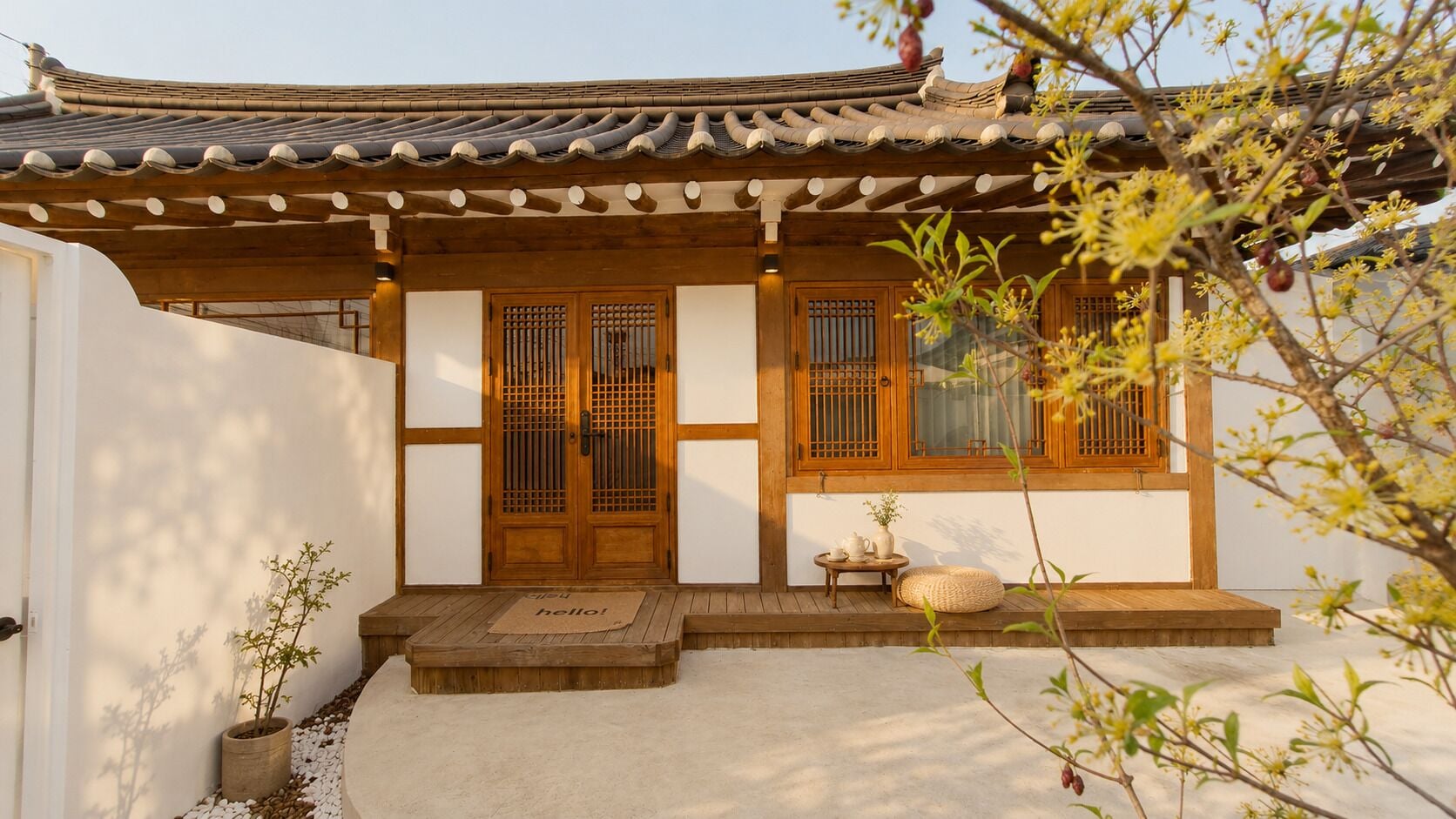 A traditional building with a tiled roof, wooden doors, and a small porch area with a welcome mat.