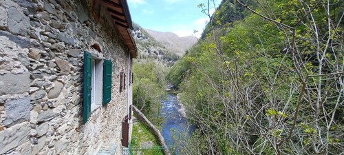 ANCIENT HOUSE ON THE RIVER