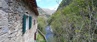 ANCIENT HOUSE ON THE RIVER