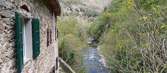 ANCIENT HOUSE ON THE RIVER