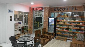 A cafe with a 'Free WiFi' sign, a 'Dacostel' branded refrigerator stocked with beverages, and a 'IBC RESTO' sign above the entrance. - Dacostel Syariah (Tjihadak)