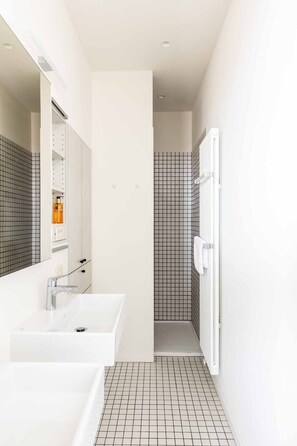 Bathtub, hair dryer, towels, soap