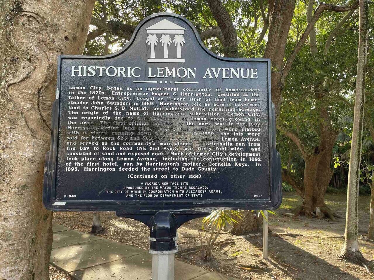 A historic signboard with text detailing the history of Lemon Avenue.