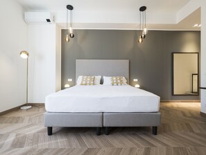 ห้องดีลักซ์สำหรับสี่ท่าน | ผ้านวมขนเป็ด, เตียงเมมโมรีโฟม, มินิบาร์, ตู้นิรภัยในห้องพัก