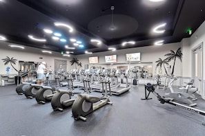 A gym with various exercise machines, including treadmills and elliptical trainers. - 2417 Newly Renovated Special ~ 3BR ~ Pools ~ Bar ~ Gym ~ Dining ~ Book Oct 15th (Destin)