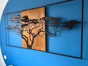 A wall with a large, abstract tree design.