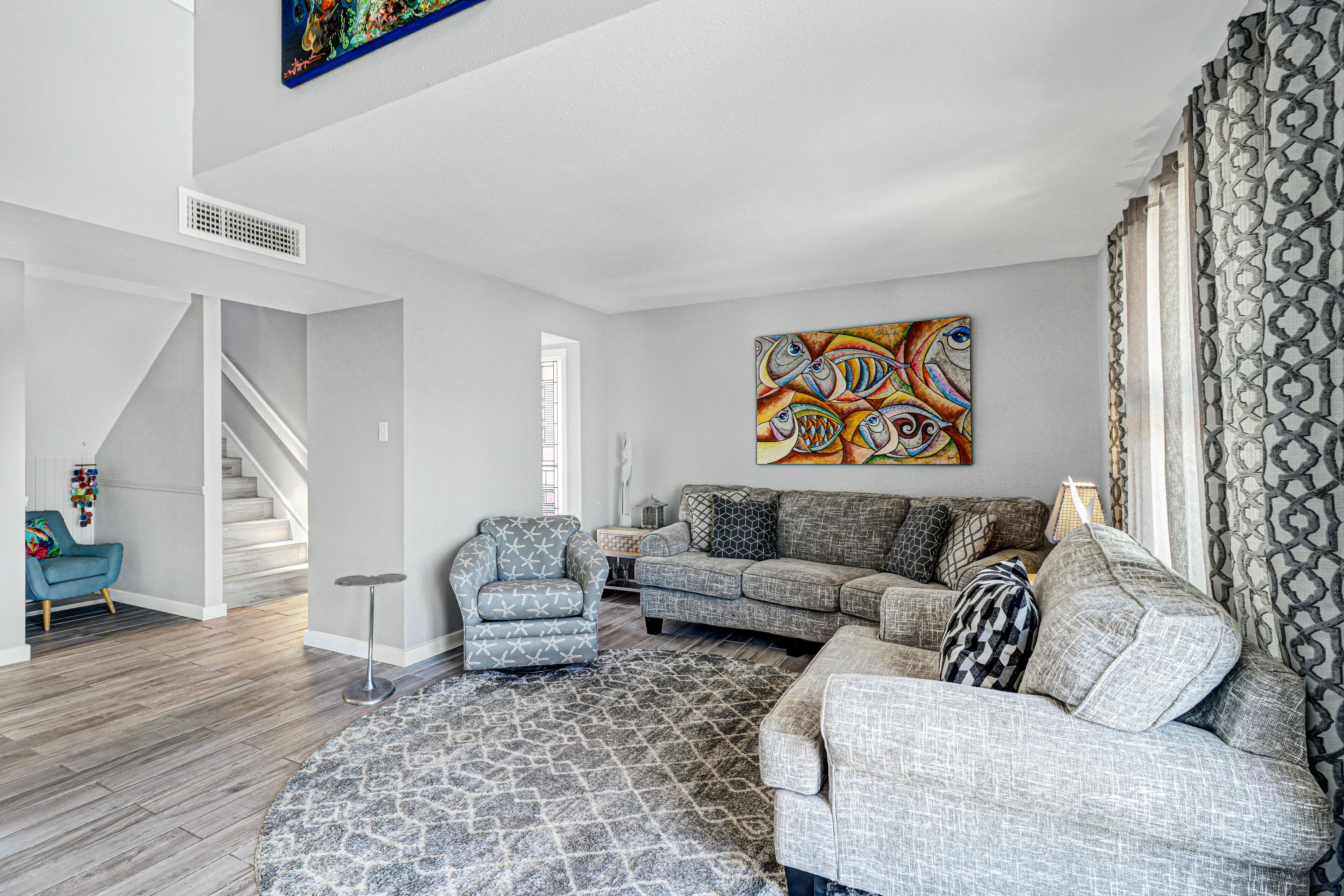 Dog-friendly canal-front condo with balconies, back patios, water views, & AC