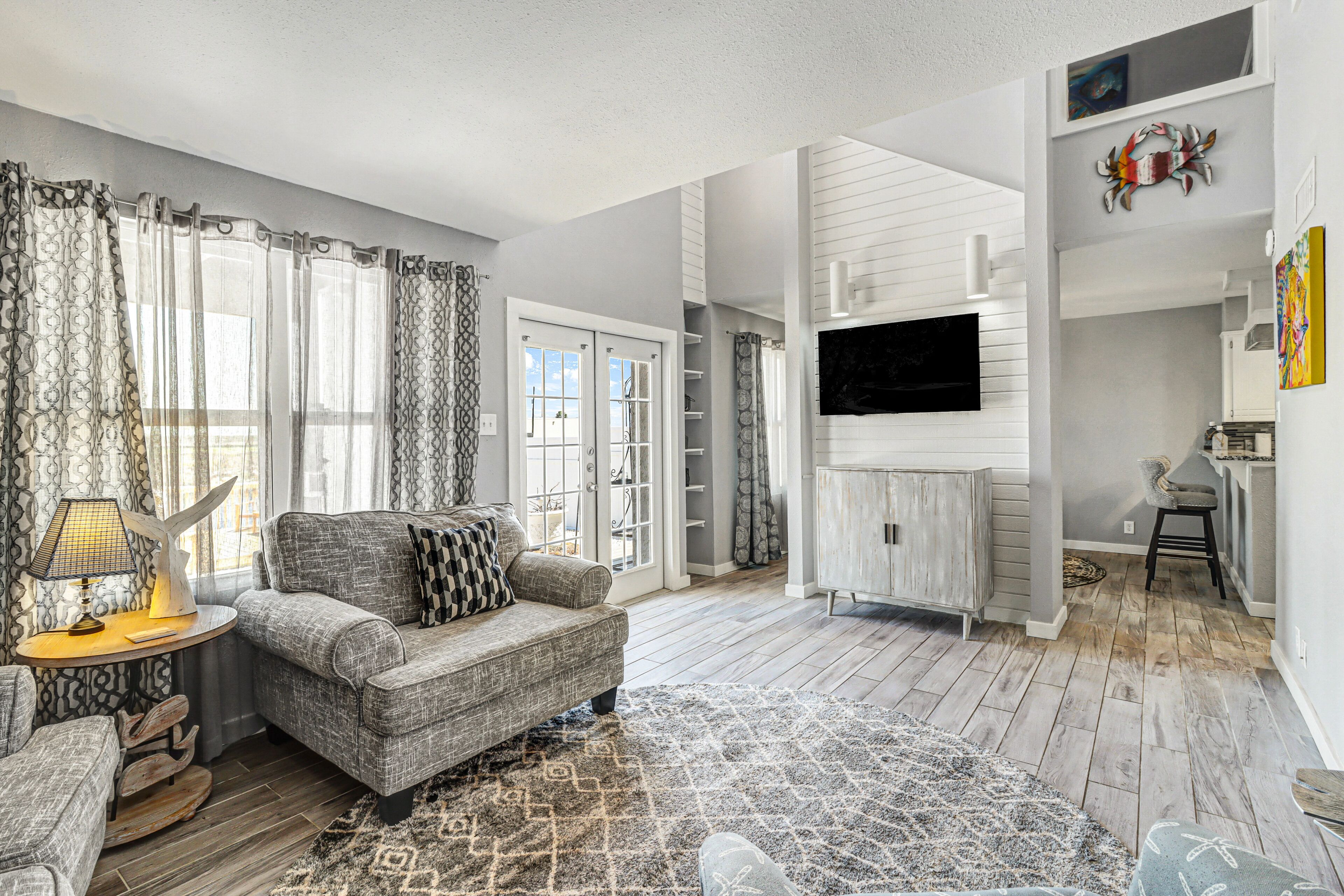 Dog-friendly canal-front condo with balconies, back patios, water views, & AC