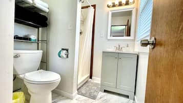 Shower, towels, soap, toilet paper