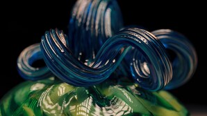A close-up of a glass sculpture with a spiral design.