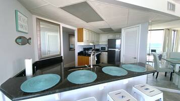 Apartment 406E | Private kitchen | Full-sized fridge, microwave, oven, stovetop