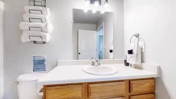 Bathtub, hair dryer, towels